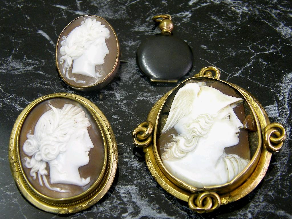 Appraisal: Three cameo brooches within gilt mounts together with a locket