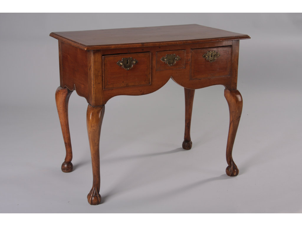 Appraisal: George II Transitional Lowboy mahogany veneers over pine rectangular top