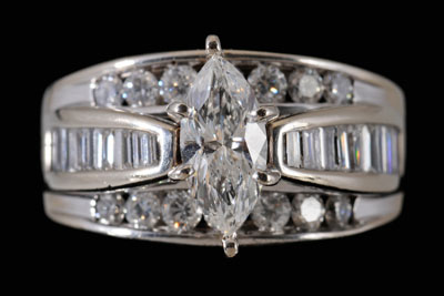 Appraisal: Diamond engagement ring central marquise-cut diamond