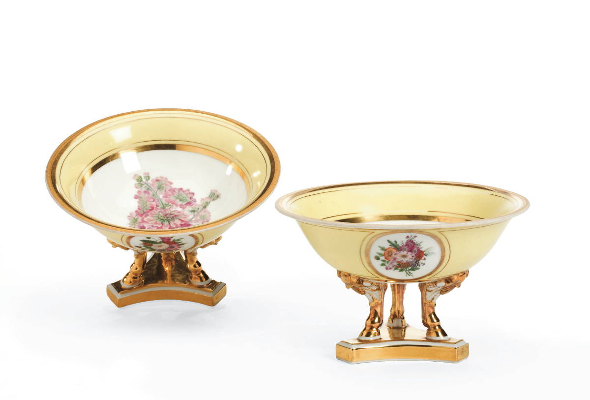 Appraisal: PAIR OF CONTINENTAL PORCELAIN GILT-DECORATED YELLOW-GROUND COMPOTES WITH FLORAL RESERVES