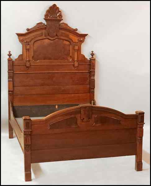 Appraisal: EASTLAKE STYLE CARVED MAHOGANY BED FRAME Comprised of a headboard