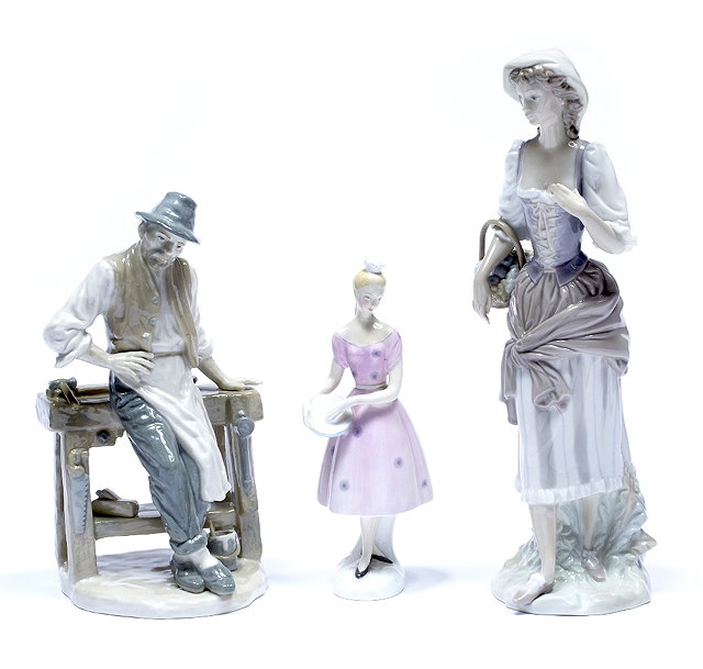 Appraisal: A Lladro porcelain standing model girl cm high and one