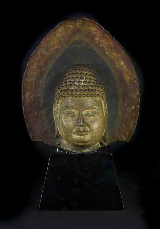 Appraisal: A Chinese Stone Model of the Head of Buddha Tang