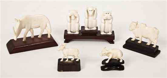 Appraisal: An Ivory Carving of Three Monkeys mounted on a wooden