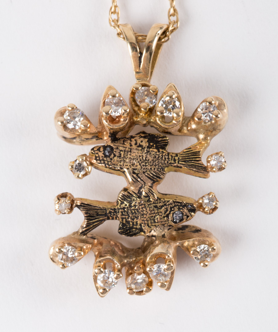 Appraisal: A Diamond and Gold Fish Pendant on a gold wheat