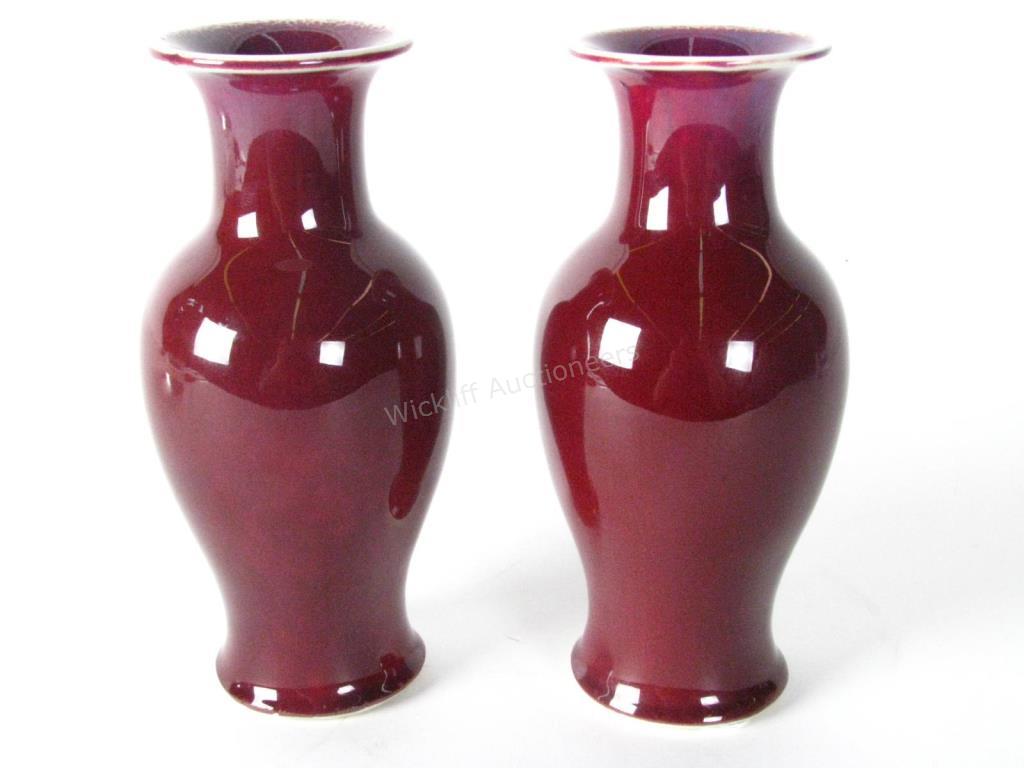 Appraisal: Pair of Oriental Oxblood Vases deep oxblood exterior oxblood interior