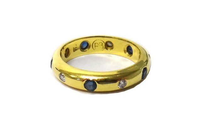 Appraisal: A gold sapphire and diamond set full eternity ring gypsy