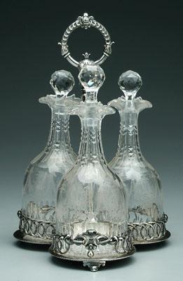 Appraisal: Three bottle decanter set three-lobed stand with rope gallery central