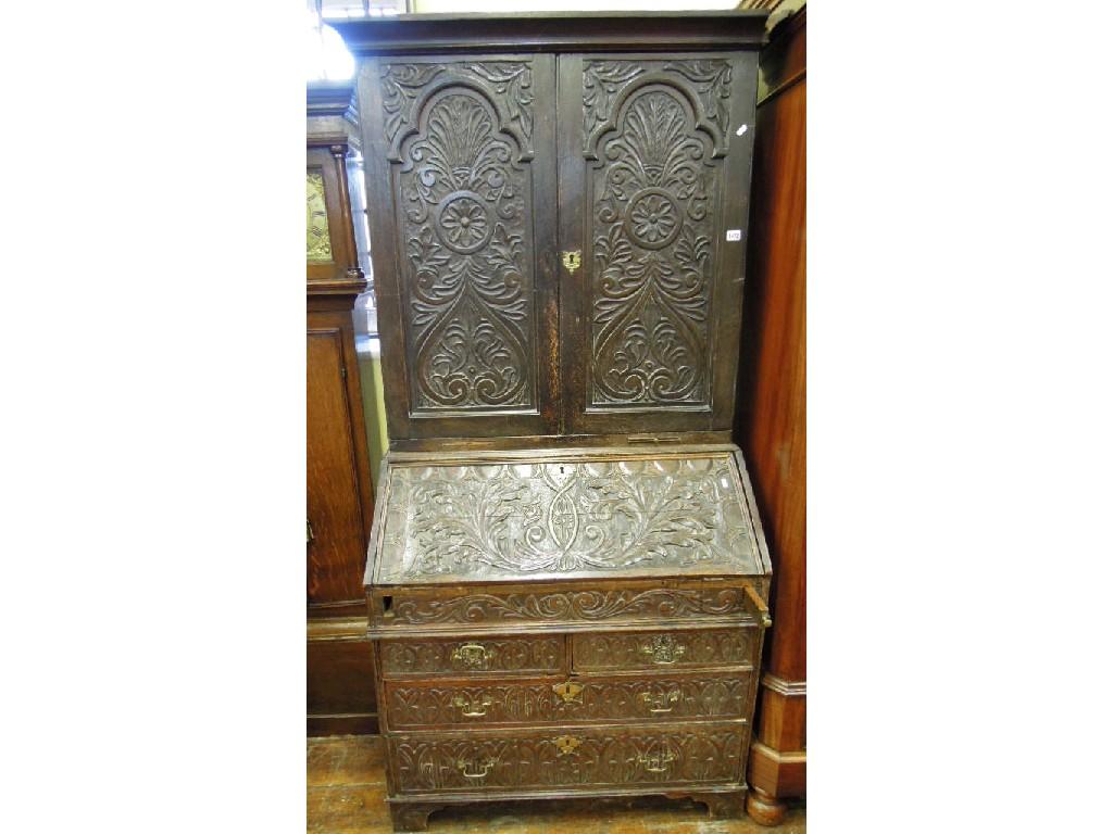 Appraisal: A Georgian oak bureau bookcase with later Victorian carved foliate