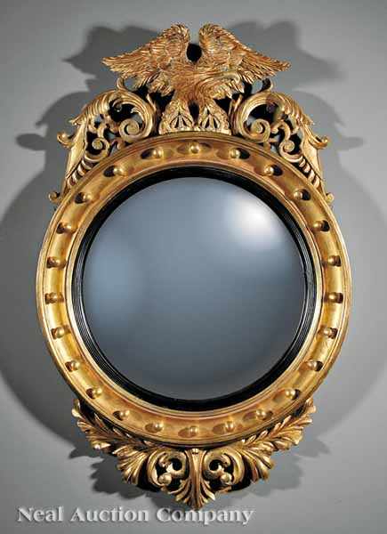 Appraisal: An English Carved and Gilded Convex Mirror early th c