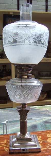 Appraisal: A silver plated and glass oil lamp converted for use