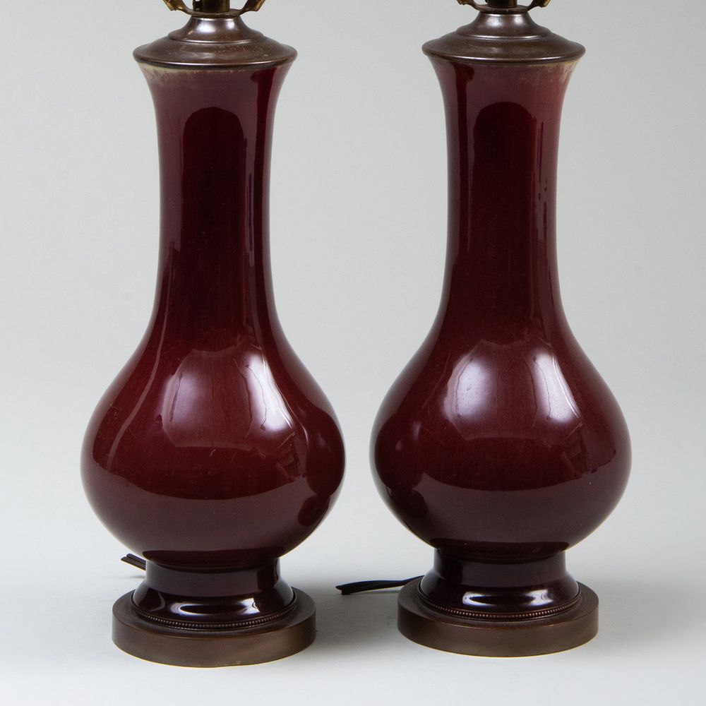 Appraisal: Pair of Small Copper Red Glazed Vases Mounted as Lamps