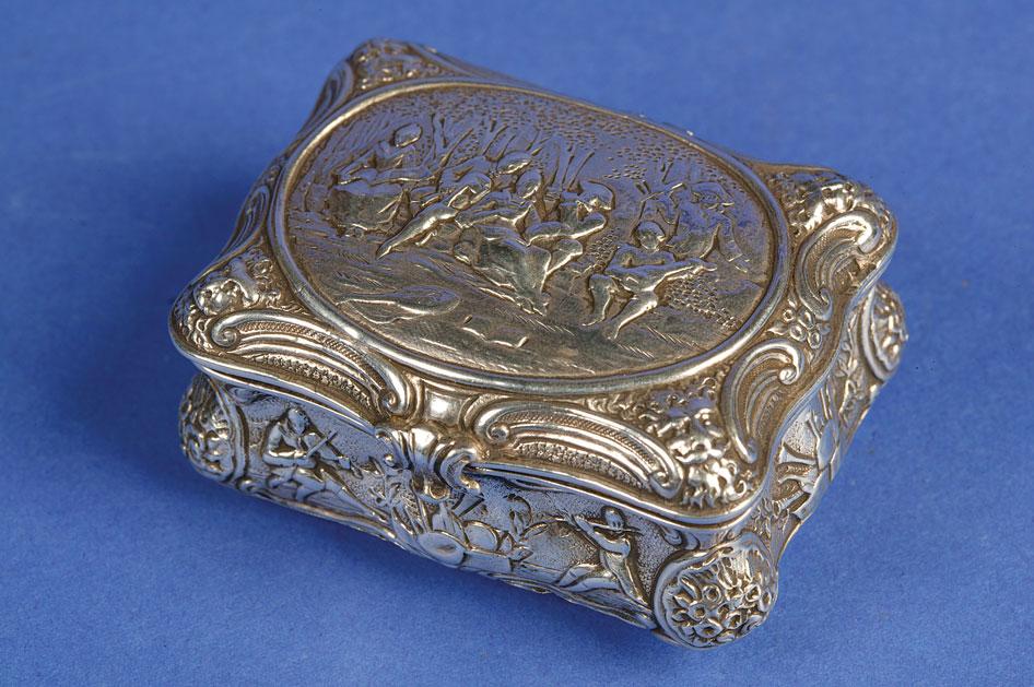 Appraisal: A CONTINENTAL SNUFF BOX of cushion form the body chased