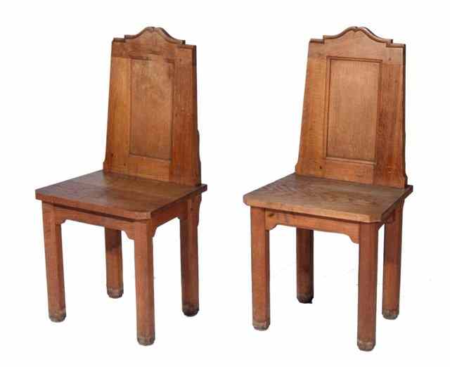 Appraisal: A PAIR OF OAK ARTS AND CRAFTS HALL CHAIRS each