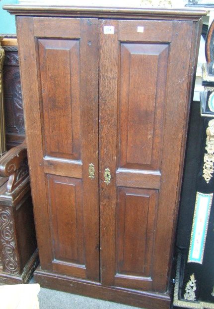 Appraisal: An th century style oak side cupboard each door with