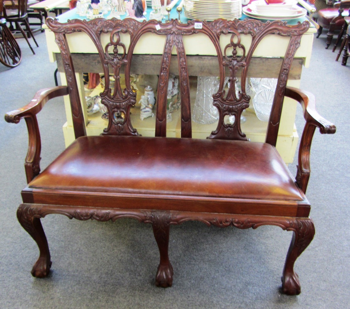 Appraisal: A Chippendale design mahogany double chair back sofa on claw