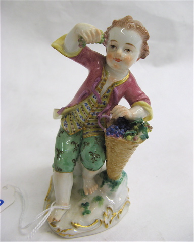 Appraisal: MEISSEN PORCELAIN FIGURE barefoot boy holding aloft grapes from his