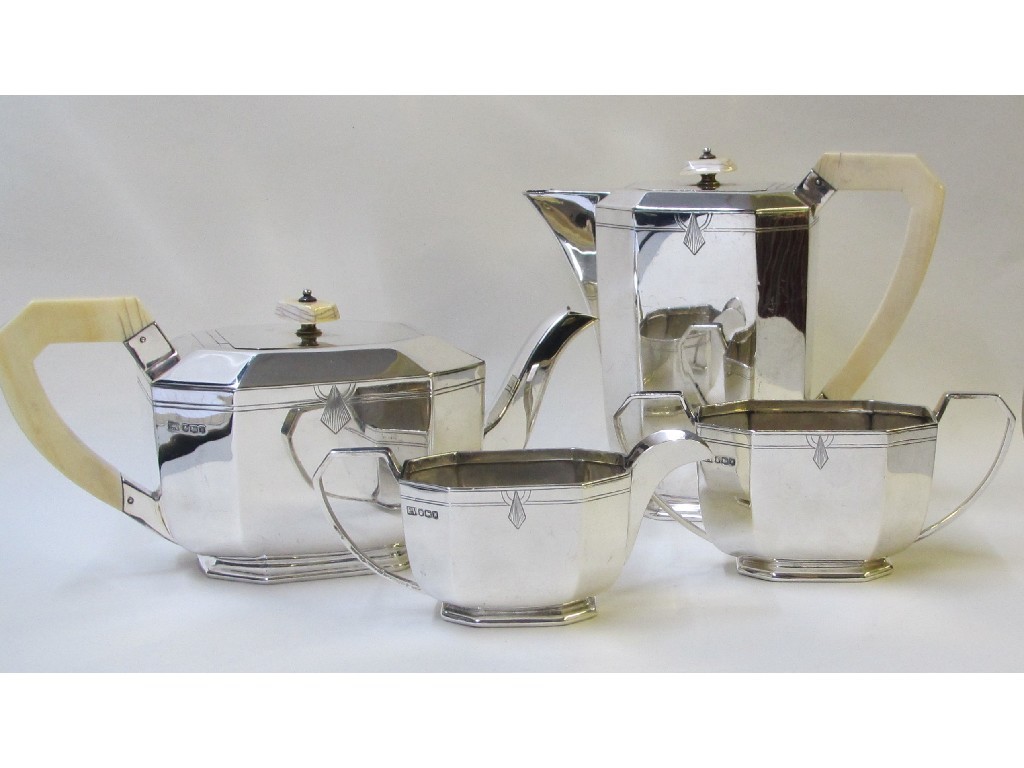 Appraisal: An Art Deco style silver and ivory four piece tea