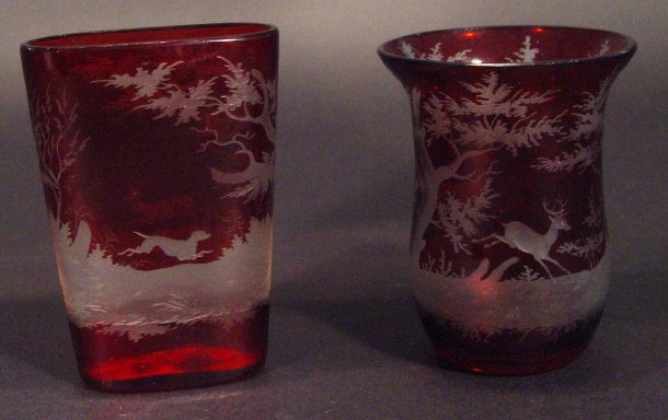 Appraisal: Two Bohemian ruby flashed glass vases each engraved with a