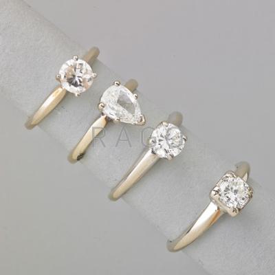 Appraisal: FOUR DIAMOND SOLITAIRE K WHITE GOLD RINGS Pear-shaped x mm