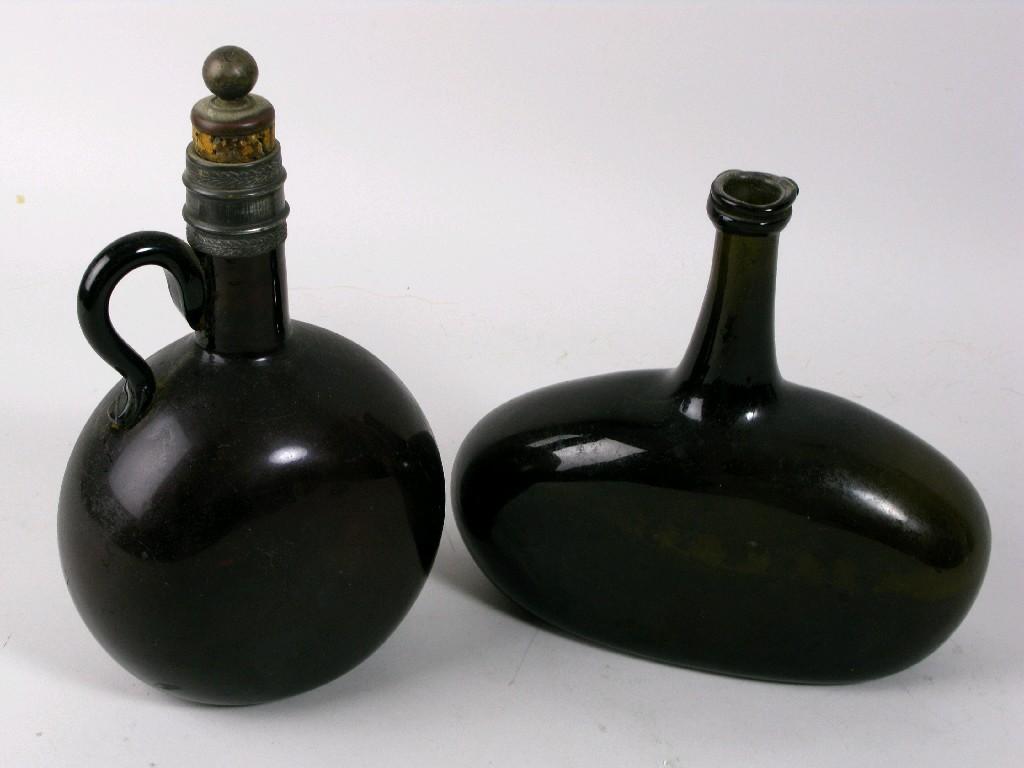 Appraisal: A Georgian green glass squat oval Bottle in H and