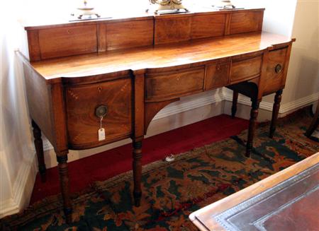 Appraisal: A Regency mahogany and inlaid sideboard of break bowfront outline