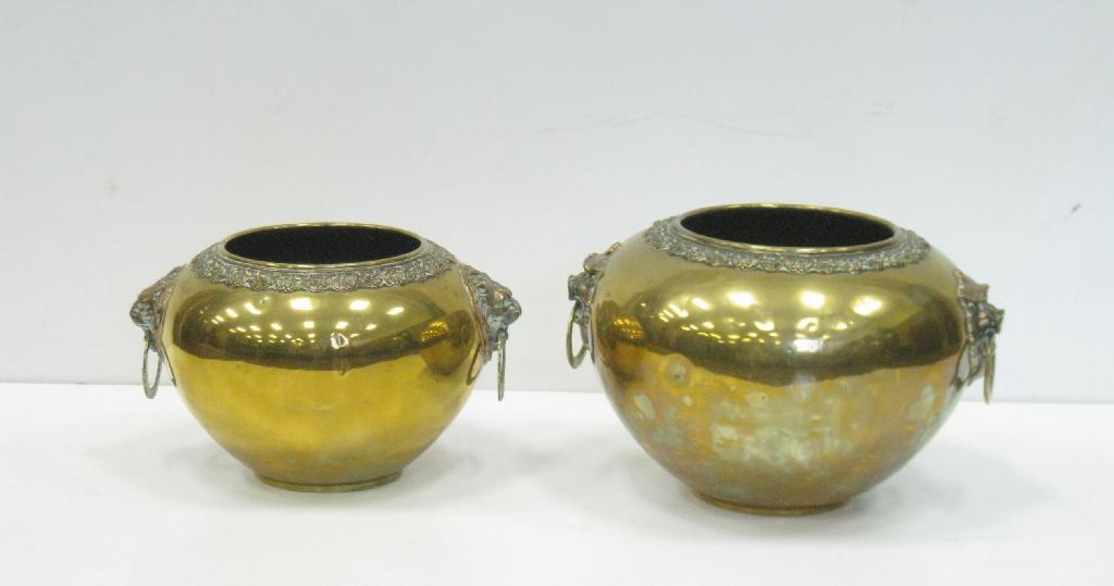 Appraisal: Two Chinese brass and bronzed two handled graduated Jardinieres with