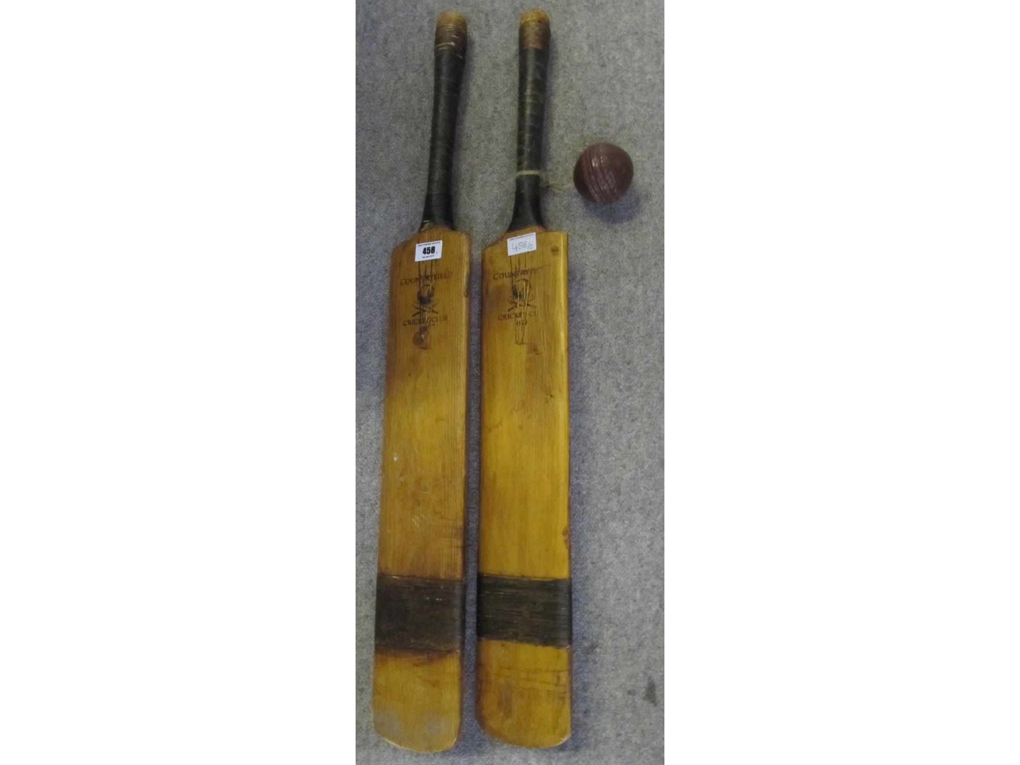 Appraisal: Two cricket bats stamped Countryfield Cricket Club and a ball