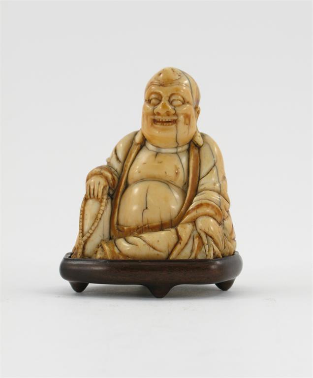 Appraisal: A small Chinese ivory carving of Buddhai Ho Shang