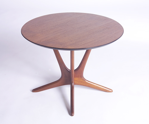 Appraisal: VLADIMIR KAGAN Oak side table with circular top on sculptural