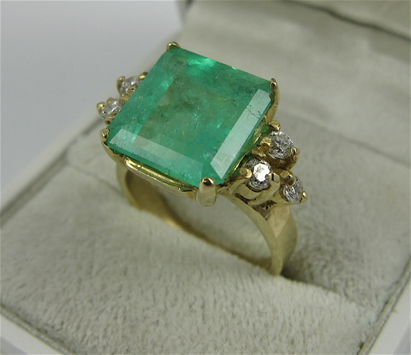 Appraisal: EMERALD DIAMOND AND K YELLOW GOLD RING centering an emerald-cut