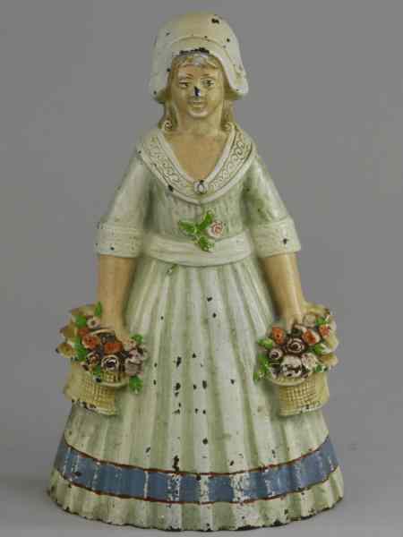 Appraisal: WOMAN HOLDING TWO FLOWER BASKETS DOORSTOP Judd Co '' ''