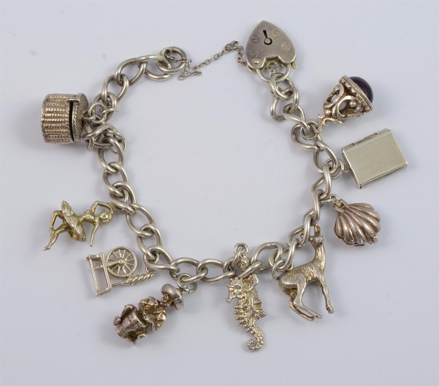 Appraisal: Sterling silver charm bracelet charms some unmarked padlock catch TO