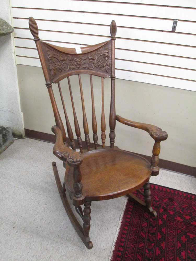 Appraisal: CARVED OAK HIGH-BACK ROCKER American late th century having a