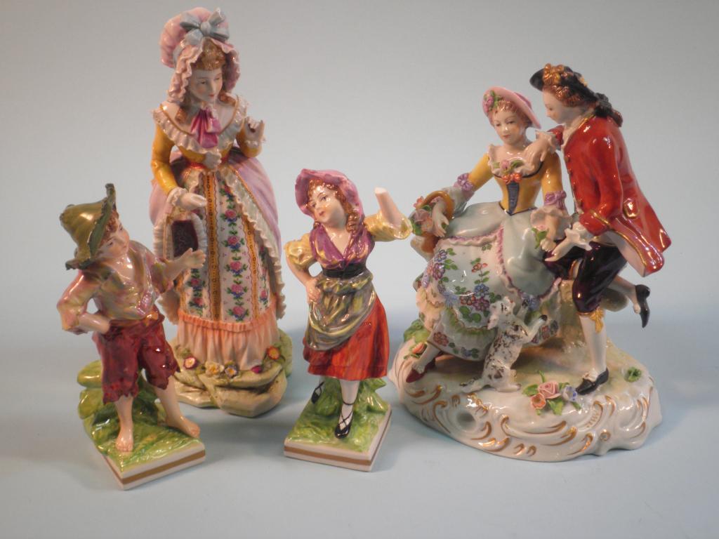 Appraisal: A Dresden figure of a gentleman and lady seated with