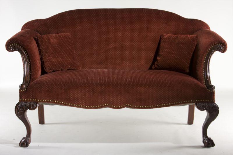 Appraisal: Chippendale Style Upholstered Settee early th century shaped back scrolled