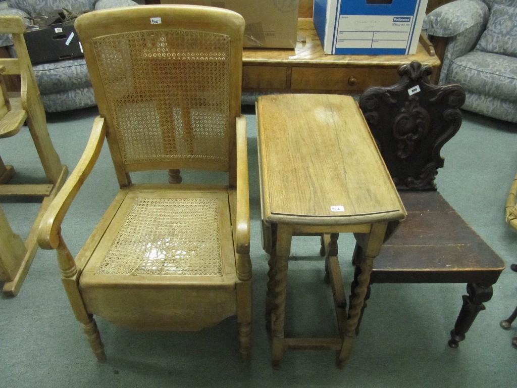 Appraisal: Victorian hall chair Victorian writing table cane mounted commode chair