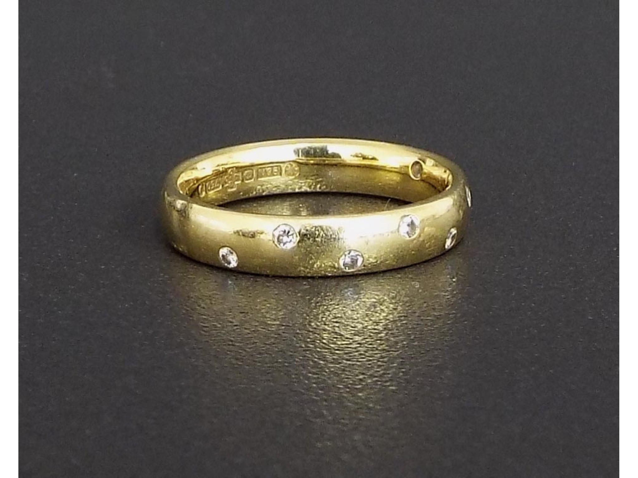 Appraisal: ct yellow gold diamond set band ring with eight small