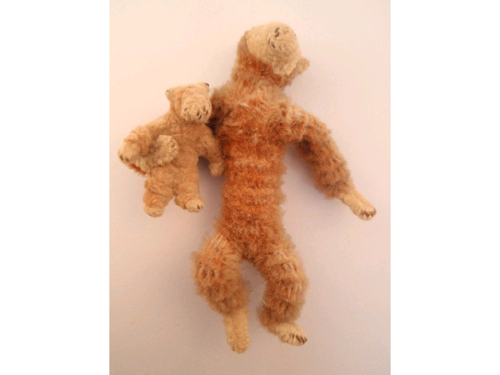 Appraisal: A miniature chenille bear holding a baby bear cm tall