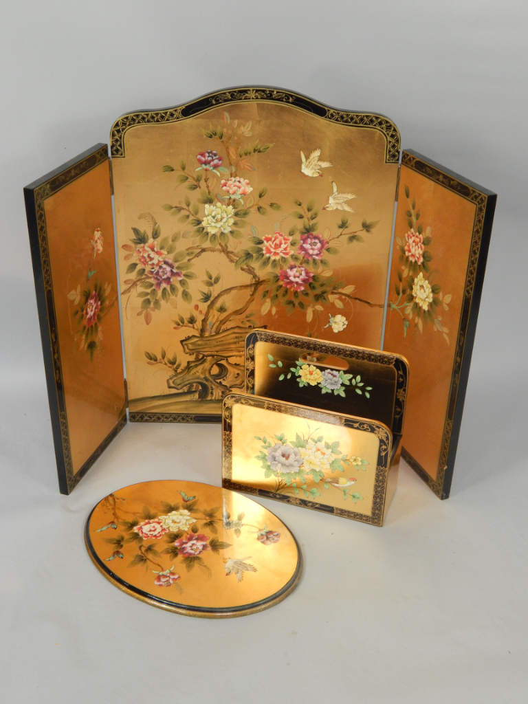 Appraisal: A gilt and black lacquered three fold screen decorated with