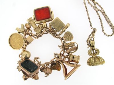 Appraisal: A gold charm bracelet The gold bracelet with assorted gold