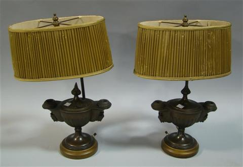 Appraisal: PAIR OF BRONZE OIL LAMPS th century after the antique