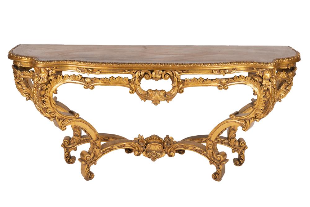 Appraisal: ROCOCO STYLE CARVED GILT WOOD CONSOLE TABLEwith serpentine top on