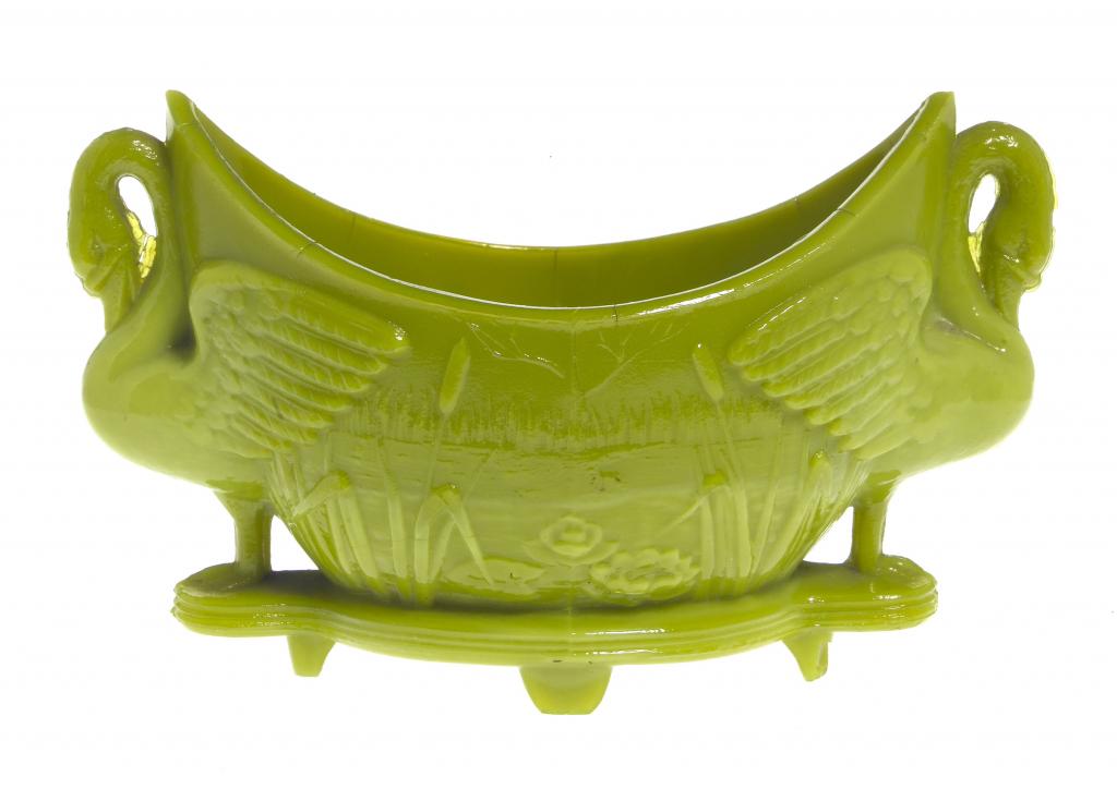 Appraisal: A SOWERBY C 'AESTHETIC GREEN' PRESS-MOULDED GLASS SWAN FLOWER- HOLDER