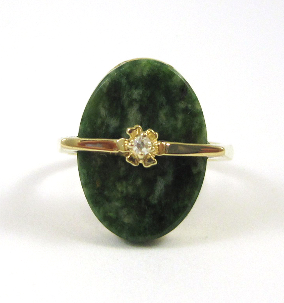 Appraisal: HARDSTONE DIAMOND AND FOURTEEN KARAT GOLD RING set with an