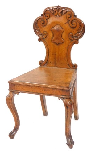 Appraisal: A Victorian oak hall chair with a foliate carved balloon