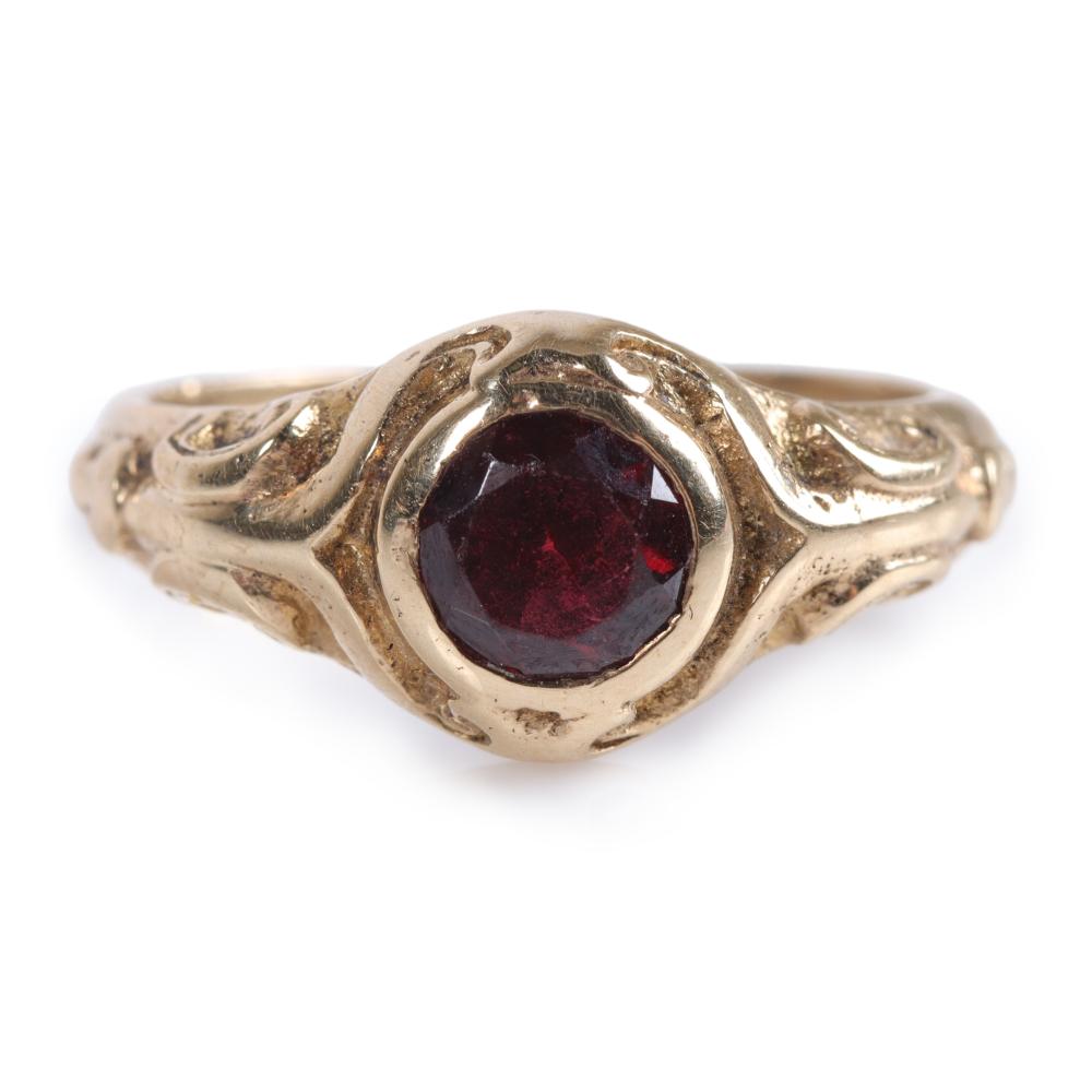 Appraisal: Antique Victorian k yellow gold round garnet ring with scrollwork