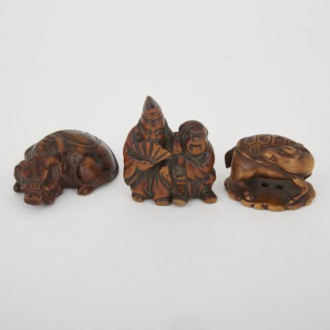 Appraisal: Three Carved Wood Netsuke Meiji Period Including a recumbent bull