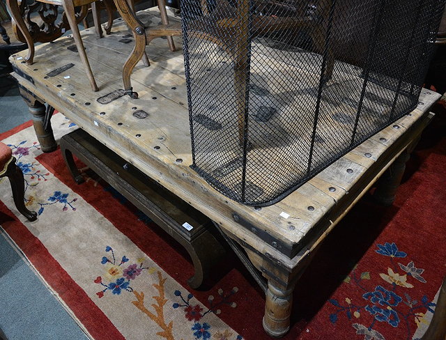 Appraisal: A large Indian hardwood and iron studded antique coffee table