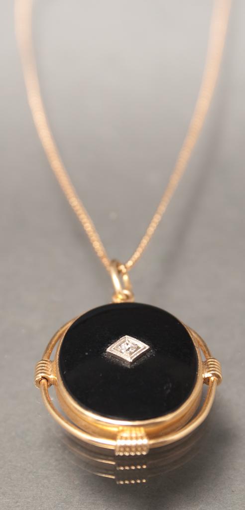 Appraisal: Art Deco K yellow gold onyx and diamond pendant-necklace